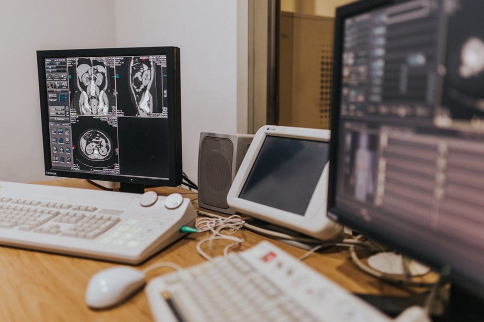 A doctor analyzing an MRI scan on a computer screen