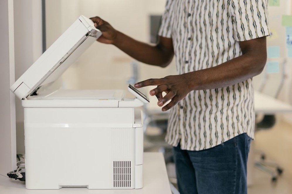 A scanner digitizing a paper document