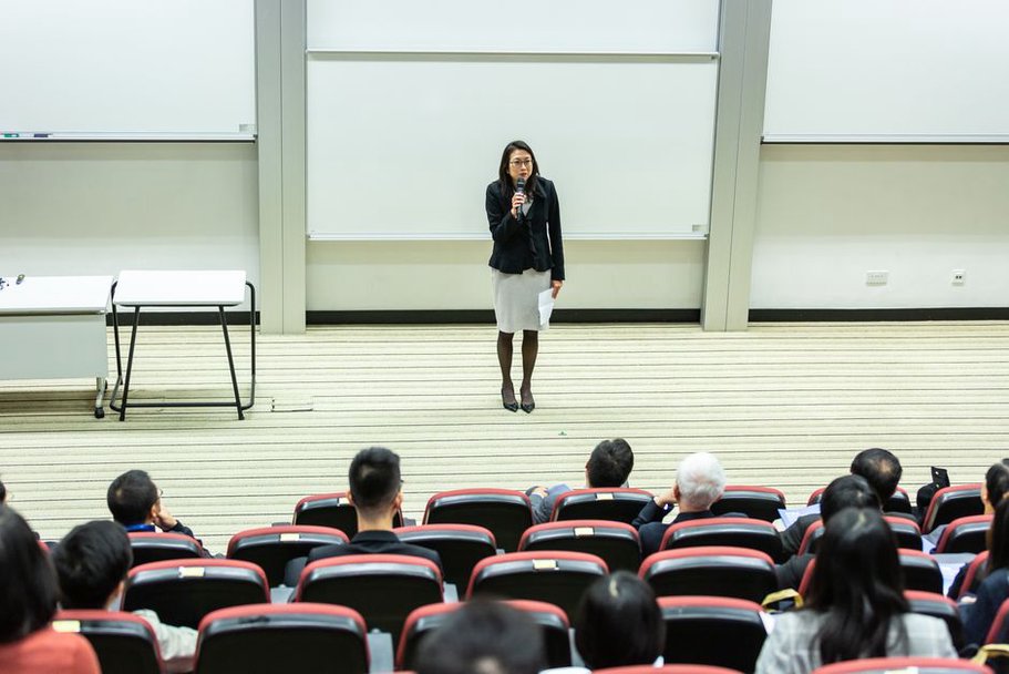 Researchers presenting papers at a conference