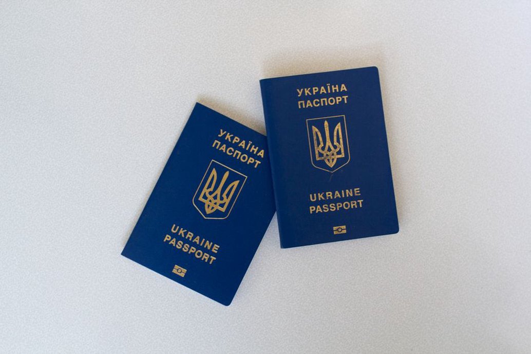 Passport and camera at an inspection desk