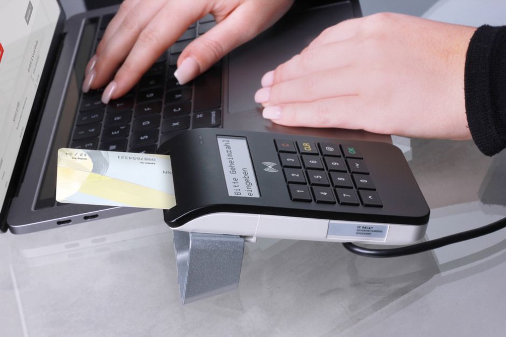 Fingerprint sensor beside a laptop keyboard