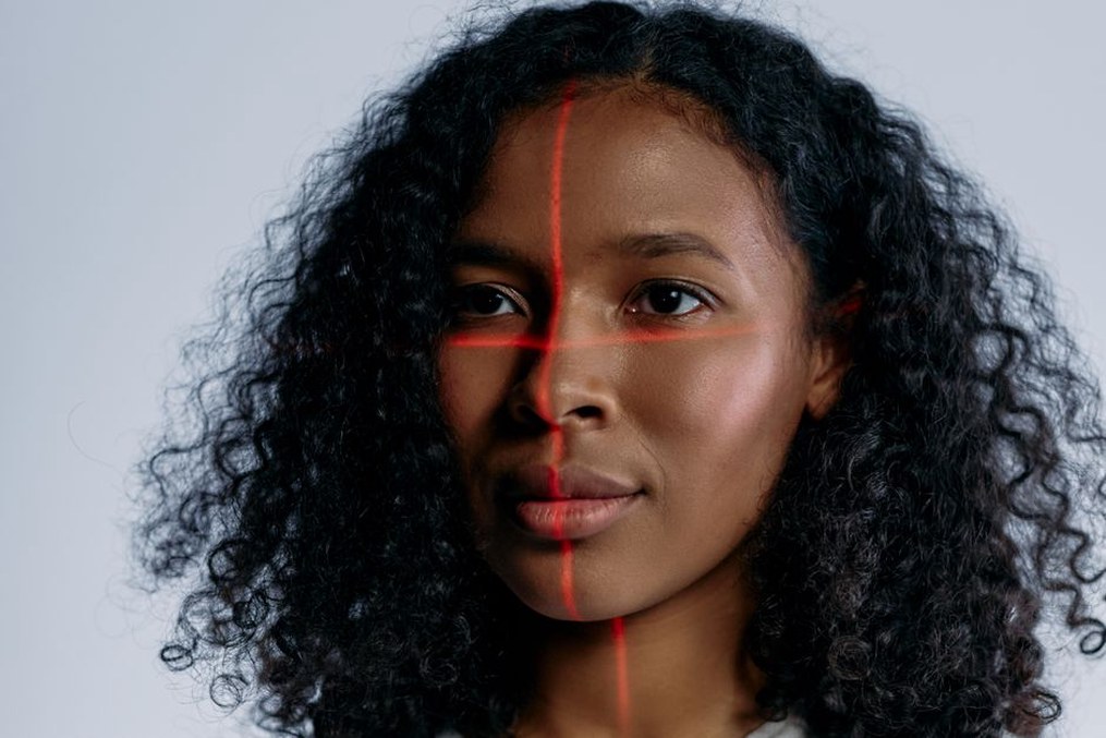 A facial recognition system analyzing faces in a crowd
