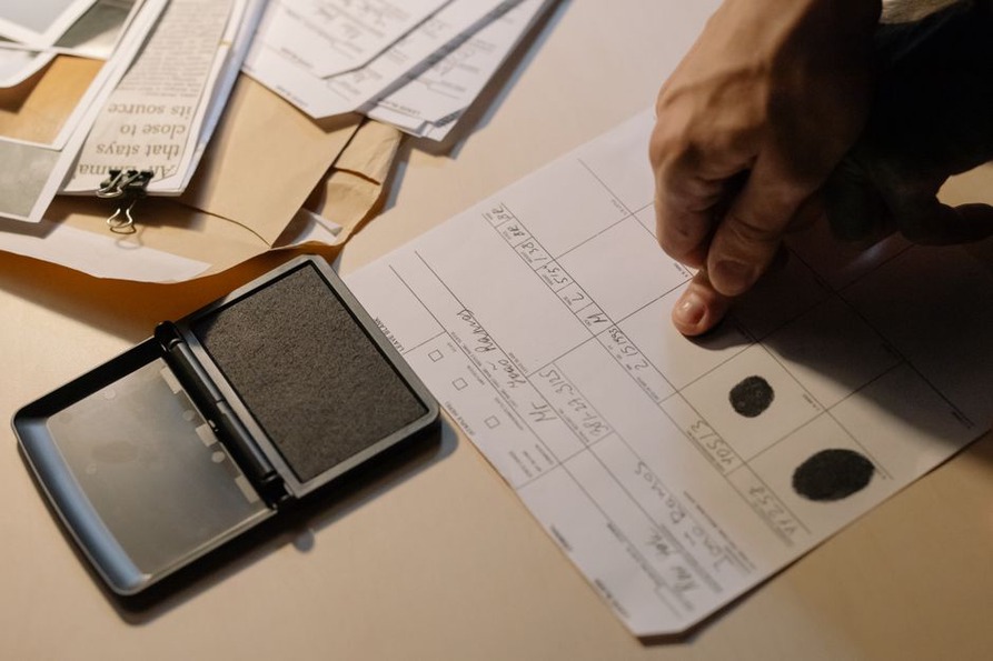 A hand enrolling on a fingerprint reader