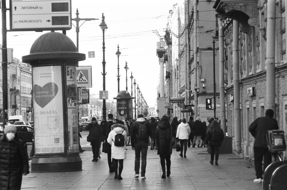multiple pedestrians tracked through a crowded plaza