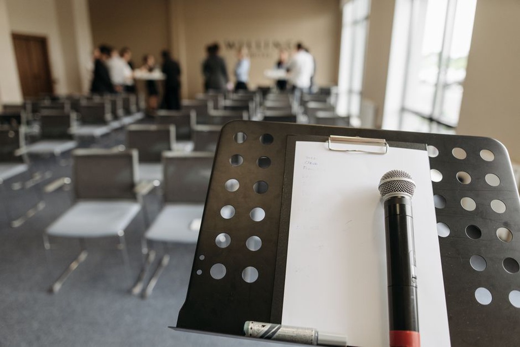 Notes and microphones at a multilingual speech workshop