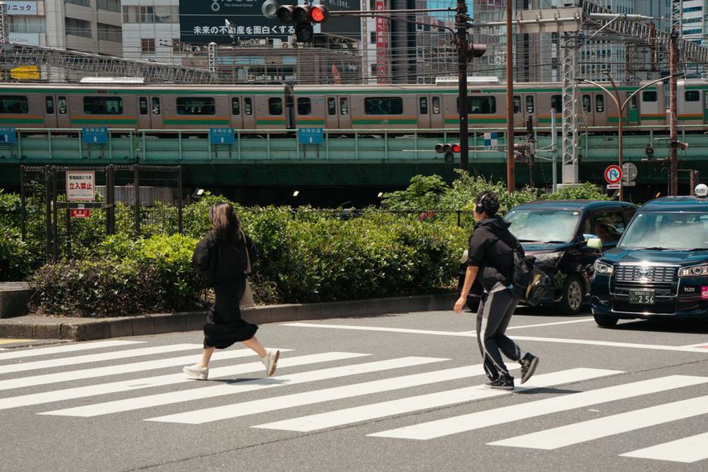 Colored boxes maintain identities through a busy street