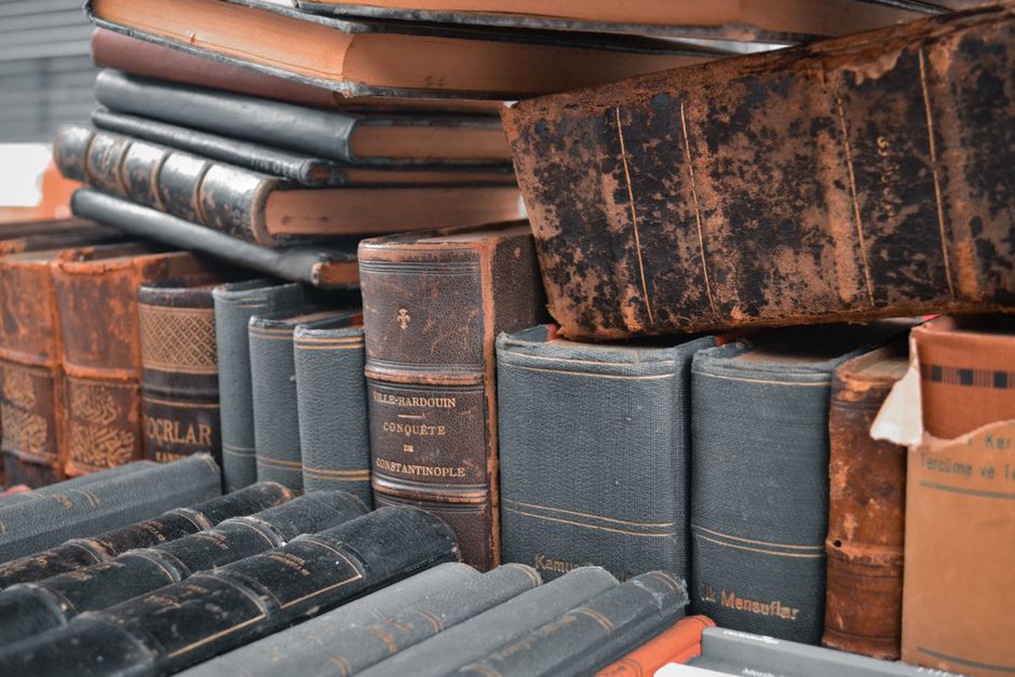 Curved lines of print beside a book spine
