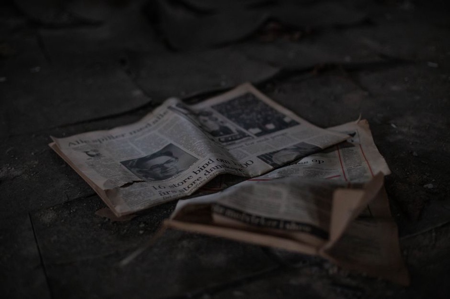 Searchable text aligned with a newspaper page
