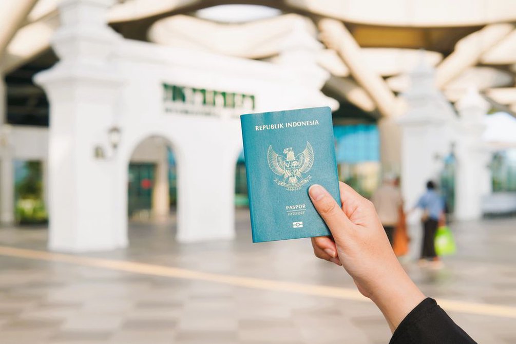 A travel document beside an inspection reader