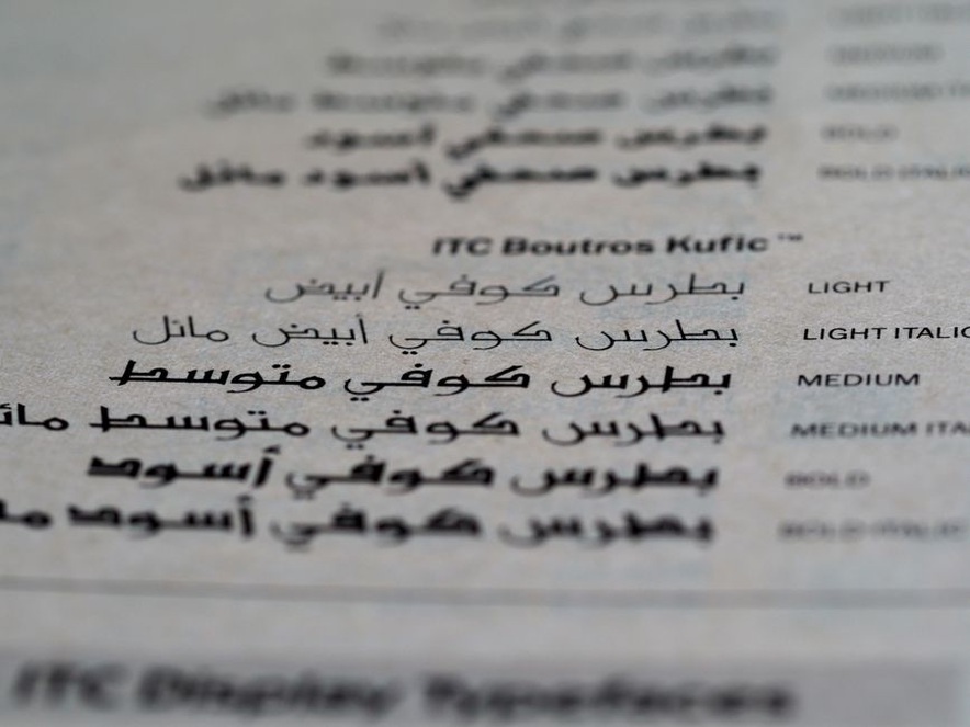 Different scripts across a collection of printed pages