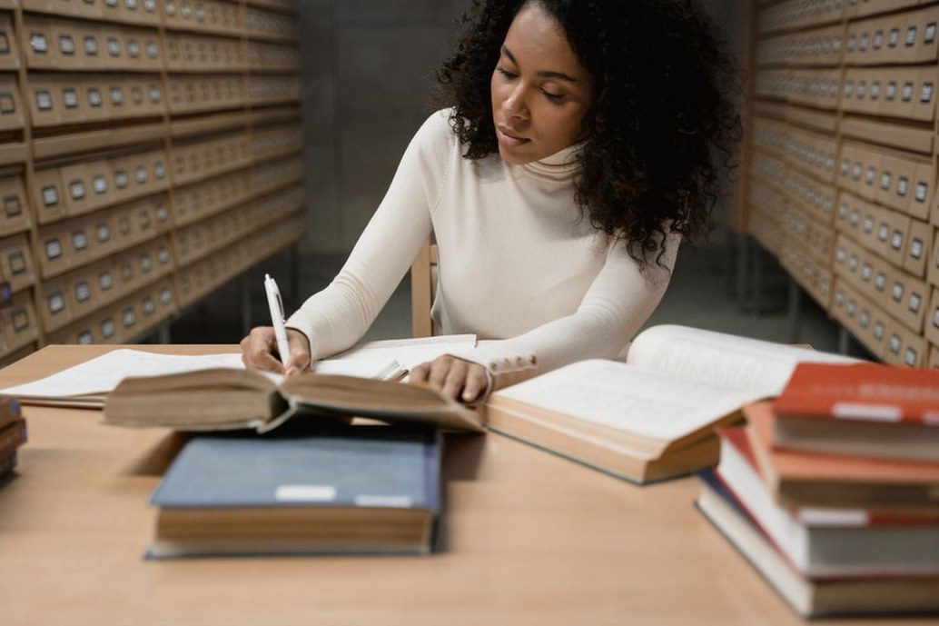 Printed research papers annotated at a desk