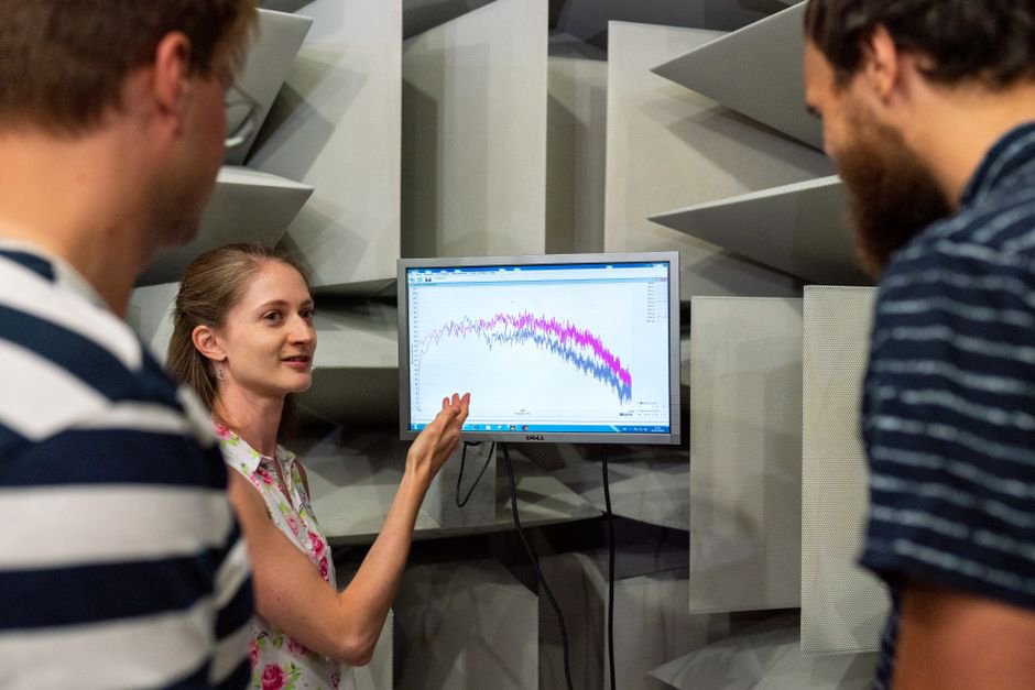 Researchers compare speech annotations at a shared workstation